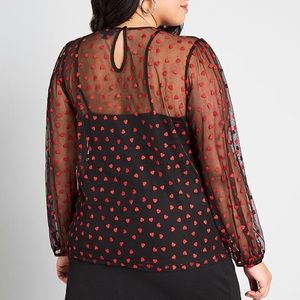 Sheer black blouse with red hearts